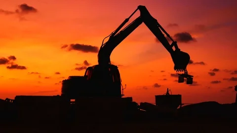 Construction Video At construction site The silhouette excavator is digging g Stock Footage 99130050