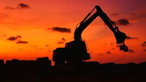 Construction Video At construction site The silhouette excavator is digging g Stock Footage 99130099