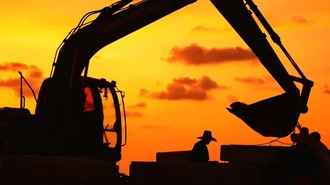 Construction Video At construction site The silhouette excavator is digging g Stock Footage 99130326