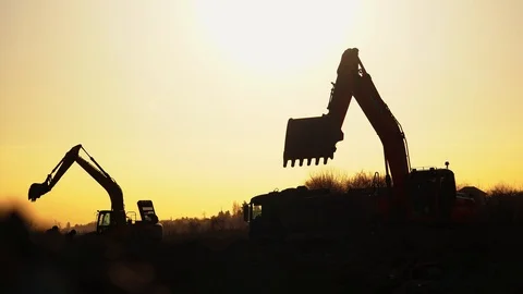Construction Video At construction site The silhouette excavator is digging Stock Footage 105148217