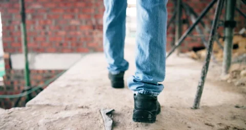 Construction, walk or legs on site with inspection, safety check or quality Stock Footage 337031965