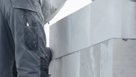 Construction of a wall of a house made of aerated concrete blocks Stock Footage 239193391