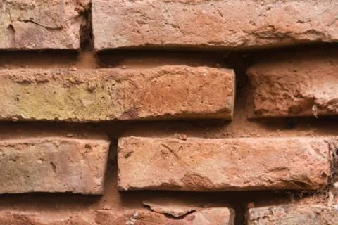 Construction of wall with texture of very old red bricks Stock Photos