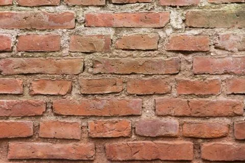 Construction of wall with texture of very old red bricks Stock Photos