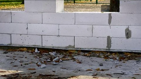 Construction of a wall from white brick blocks Stock Photos