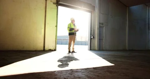 Construction, warehouse and man on tablet thinking for inspection, building Fotos de archivo