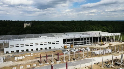 Construction of a warehouse in a logistics center Video stock 235715790
