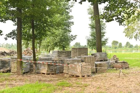 A construction warehouse for storing bricks in the open air. Stock Photos