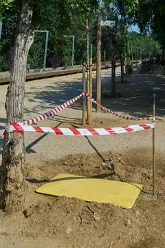 Construction warning tape in park Stock Photos