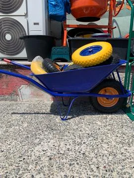 Construction Wheelbarrow with Colorful Polyurethane Wheels Stock Photos