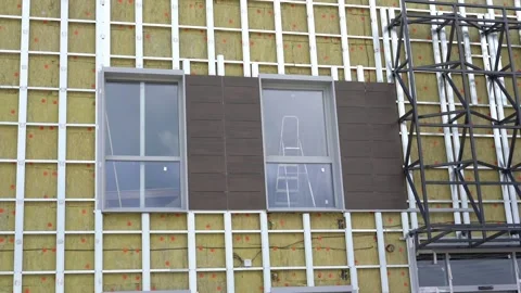 Construction with white poles and windows at black support Video stock 134999034