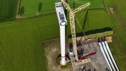 Construction of a wind power generator.  Aerial drone view of a wind farm Stock Footage 332113687