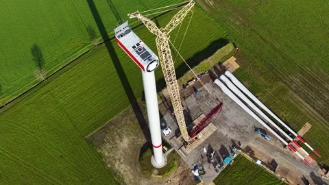 Construction of a wind power generator.  Aerial drone view of a wind farm Stock Footage 332681113