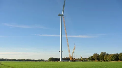 Construction of a windturbine in the Netherlands Stock Footage 289955135