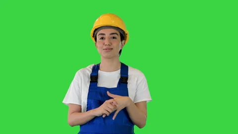 Construction woman in hardhat talking looking at camera on a Green Screen Stock Footage 156864009