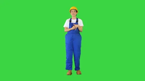 Construction woman in hardhat talking looking at camera on a Green Screen Stock Footage 157023927