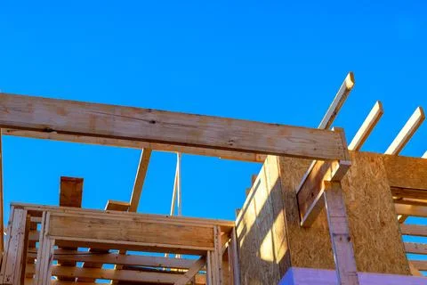 Construction of wooden framework under joist installation on roof Stock Photos