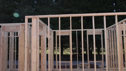 Construction of wooden house frame with studs joist roof structure Stock Footage 326012840