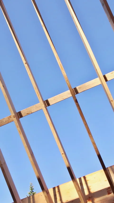 Construction of wooden structure with timber beams in building site Stock Footage 342757795