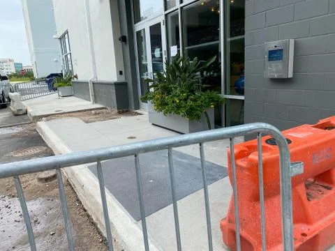 Construction work being performed on a sidewalk Stock-Fotos