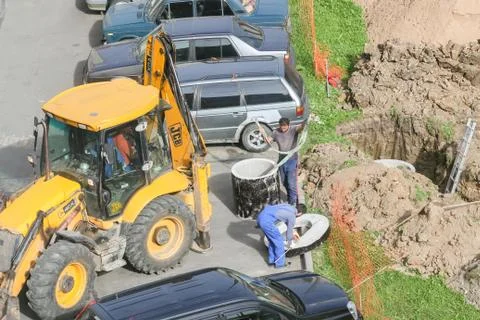 Construction work between cars. Stock Photos