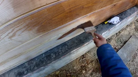 Construction work with a brush in a house built of wood Stock-Footage 95821703