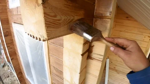 Construction work with a brush in a house built of wood Stock-Footage 95821738
