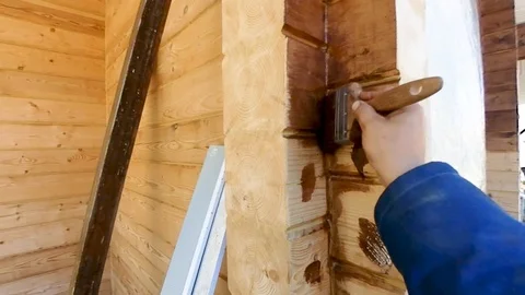 Construction work with a brush in a house built of wood Stock-Footage 95821803