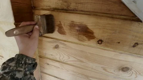Construction work with a brush in a house built of wood Stock-Footage 96025260