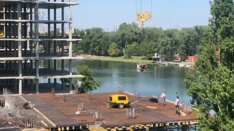 Construction work. Builders at the construction site. Working process at the Stock Footage 197686992
