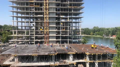 Construction work. Builders at the construction site. Working process at the Stock Footage 202612053