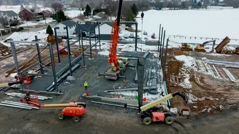 Construction Work on a Building Site With Cranes and Machinery at Winter Time Stock Footage 334256621