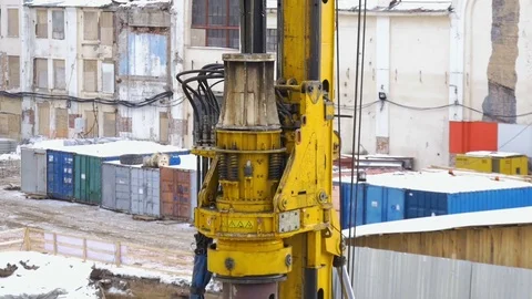 Construction work on a building site. Making holes for the altitude bearings Stock Footage 72543404
