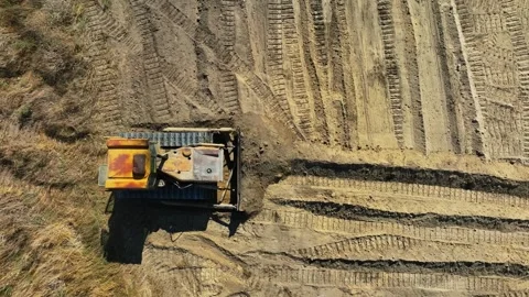 Construction work of bulldozer during road construction.leveling the sandy base. Stock Footage 304564893