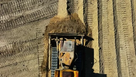 Construction work of bulldozer during road construction.leveling the sandy base. Stock Footage 304564895