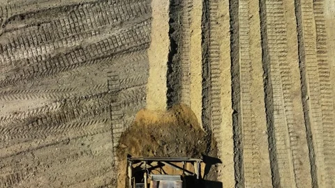 Construction work of bulldozer during road construction.leveling the sandy base. Stock Footage 304564927