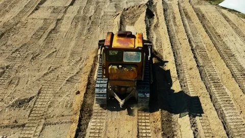Construction work of bulldozer during road construction.leveling the sandy base. Stock Footage 304565004