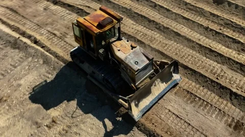 Construction work of bulldozer during road construction.leveling the sandy base. Stock Footage 304565113