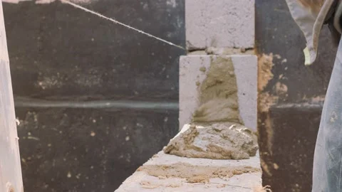 Construction work. Cinder block laying. Work of masons. Video stock 141383548