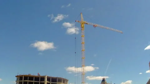 Construction work on the construction of the building using a tower crane. Time Stock Footage 108933439