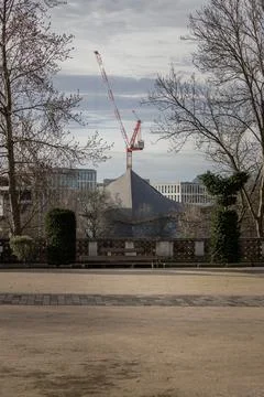 Construction work with crane and Hyperbolic-paraboloid roof of The design m.. Stock Photos