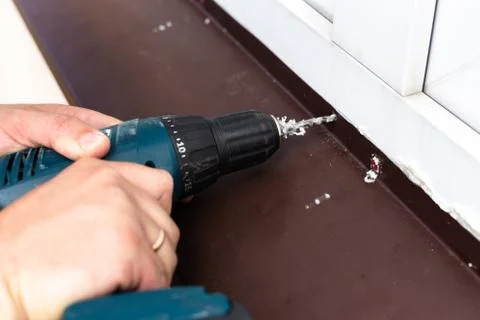 Construction work - drilling holes. Stock Photos