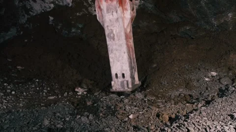 Construction Work, Drilling machine is drilling huge rocks in the tunnel Stock Footage 204102099