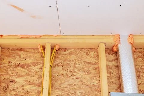 Construction work fire proof insulation wiring in building under renovation.. Stock Photos