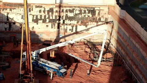 Construction work on the foundation of a New Apartment Building Stock Footage 283410206