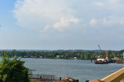 Construction work going on ,beside a river in Goa, India Stock Photos