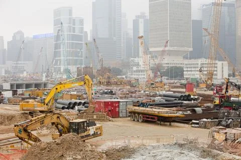 Construction work on the harbour front in Hong Kong, during smoggy conditions Stock Photos