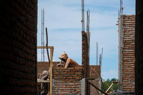 Construction work. house under construction. Builders are building a house .. Stock Photos