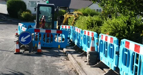 Construction work to install fibre optic broadband to a street in Ambleside,  Stock Footage 240394088