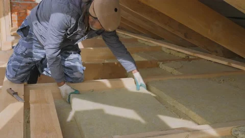 Construction work. Installation of insulation using. Stock Footage 143652406